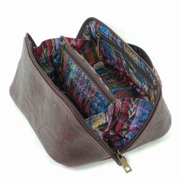 Brown leather toiletry bag with a colorful Guatemalan fabric liner