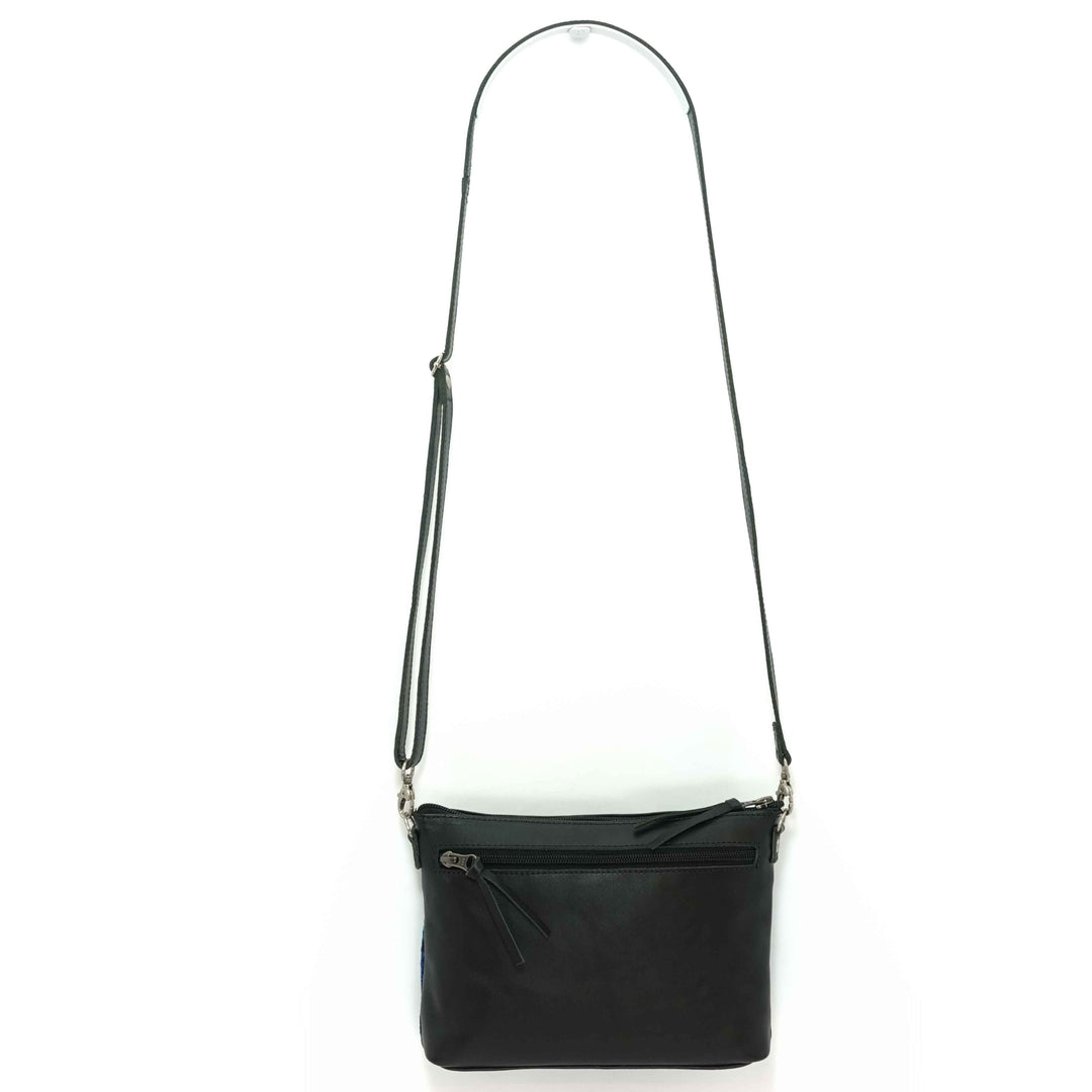 Artisan crafted crossbody bag, back view of black leather 