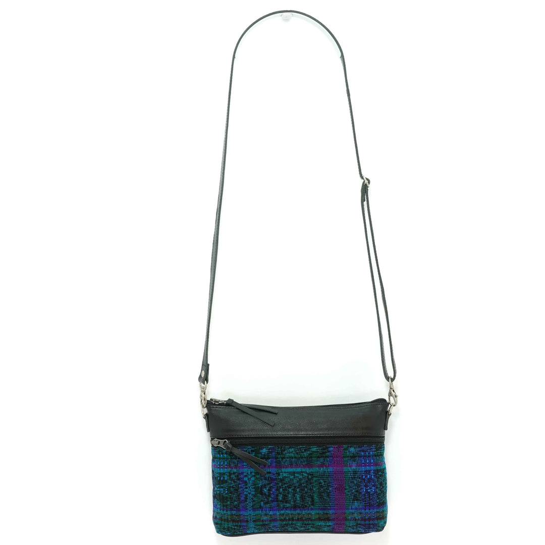 Artisan crafted Guatemalan crossbody bag in blue, green and purple plaid on a white background