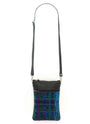 Artisan crafted Guatemalan crossbody bag in a blue, green and purple plaid with black leather accents