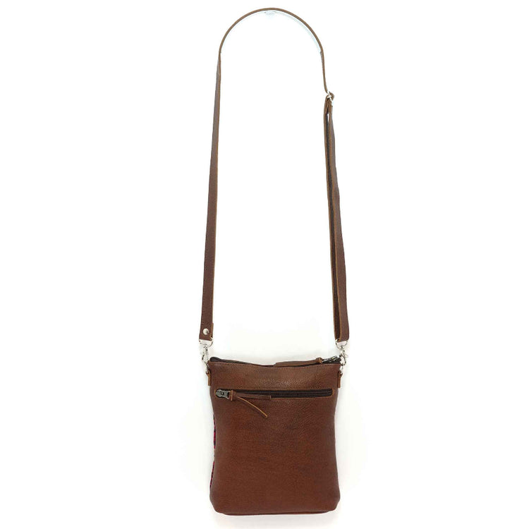 Brown leather crossbody bag on a white background