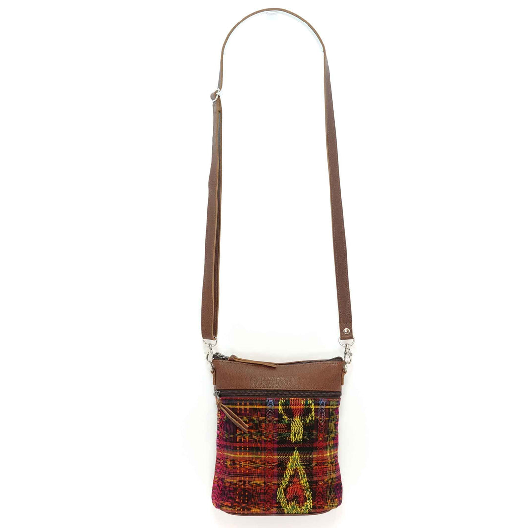 Artisan crafted Guatemalan crossbody bag in a tcolorful fabric with brown leather accents