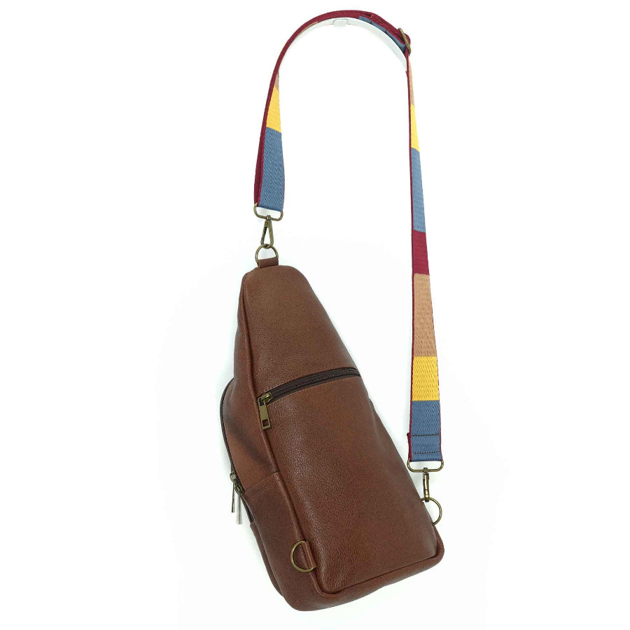 Artisanal leather sling bag in a cinnamon brown., back view. Made in Guatemala