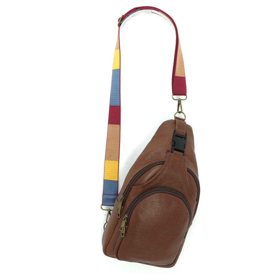 Artisanal leather sling bag in a cinnamon brown.  Made in Guatemala