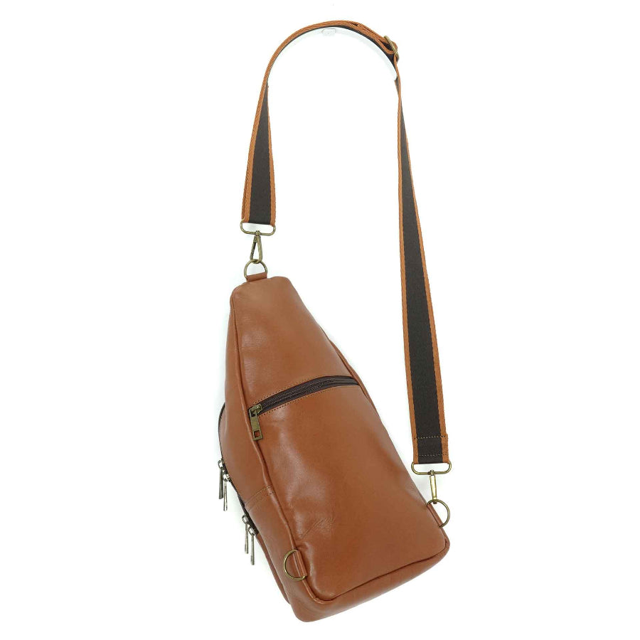 Artisanal leather sling bag in a light brown., back view.  Made in Guatemala