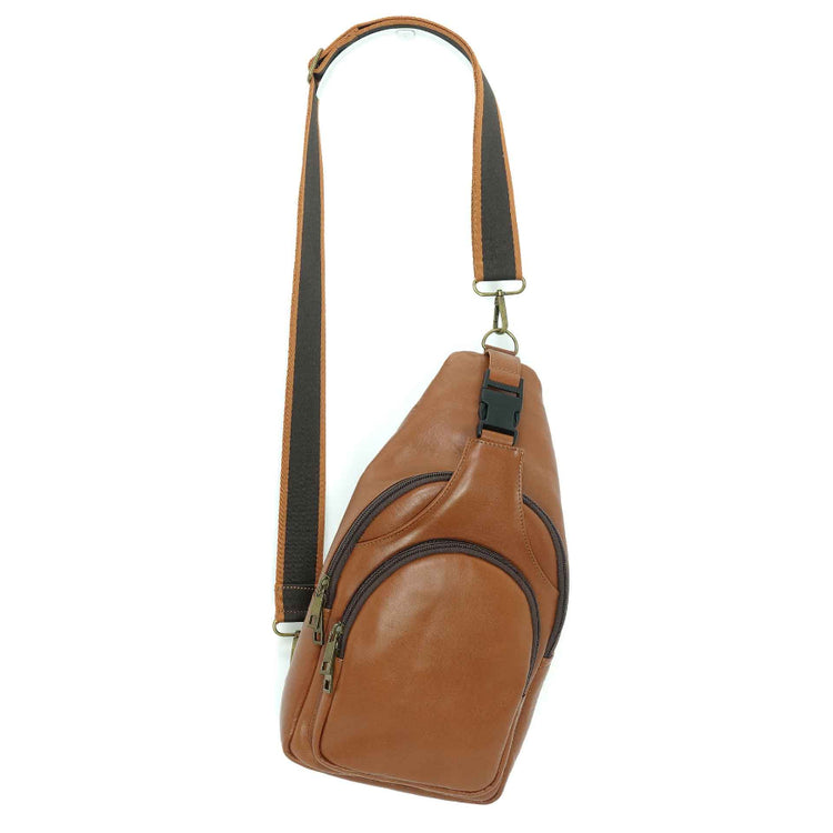 Artisanal leather sling bag in a cognac brown.  Made in Guatemala