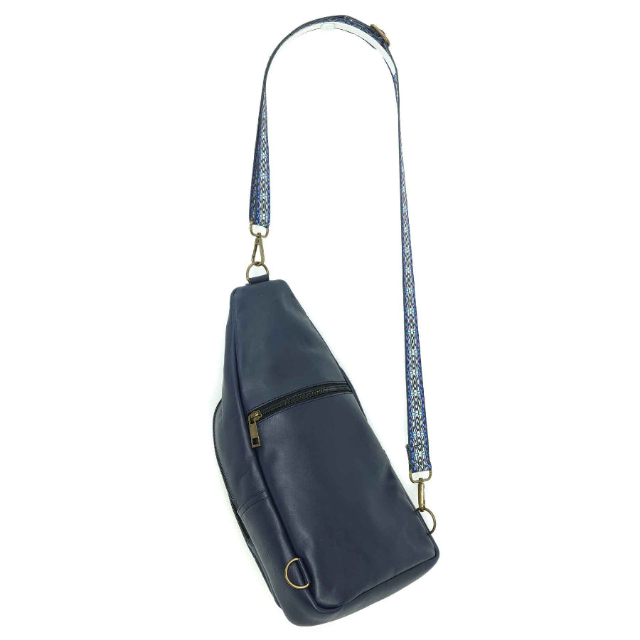 Artisanal leather sling bag in an indigo blue., back view.  Made in Guatemala 