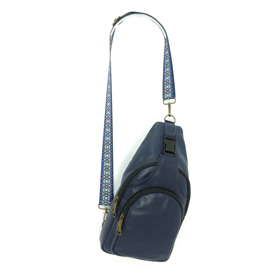 Artisanal leather sling bag in an indigo blue.    Made in Guatemala