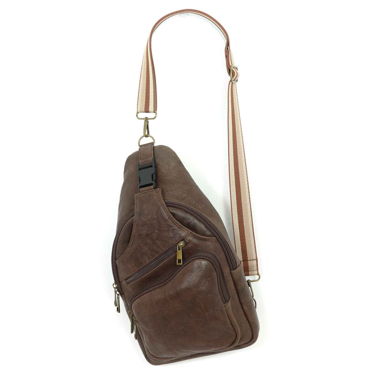 Artisanal leather sling bag in a carob brown, size large