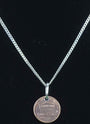 Delicate cuban style sterling-silver-chain with a penny pendant