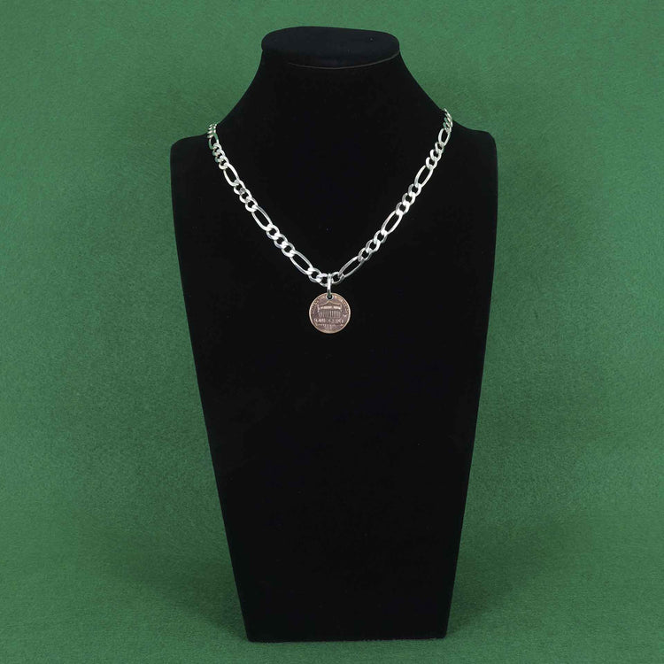 Heavy figaro style sterling silver chain with a penny pendant