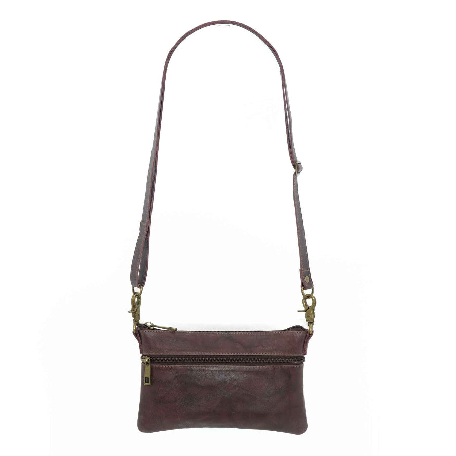 Handcrafted leahter belt bag in a merlot color
