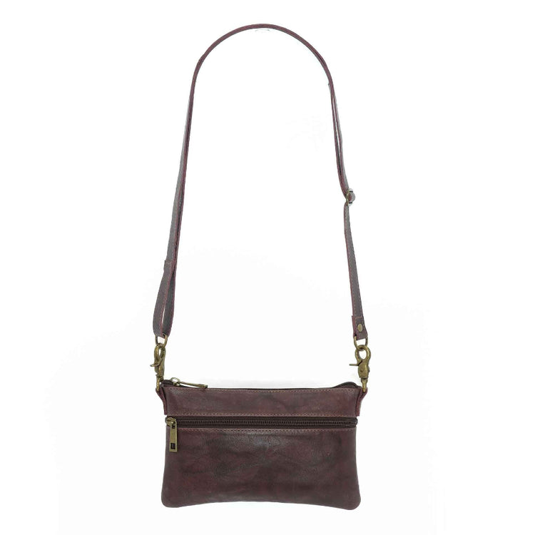 Handcrafted leahter belt bag in a merlot color