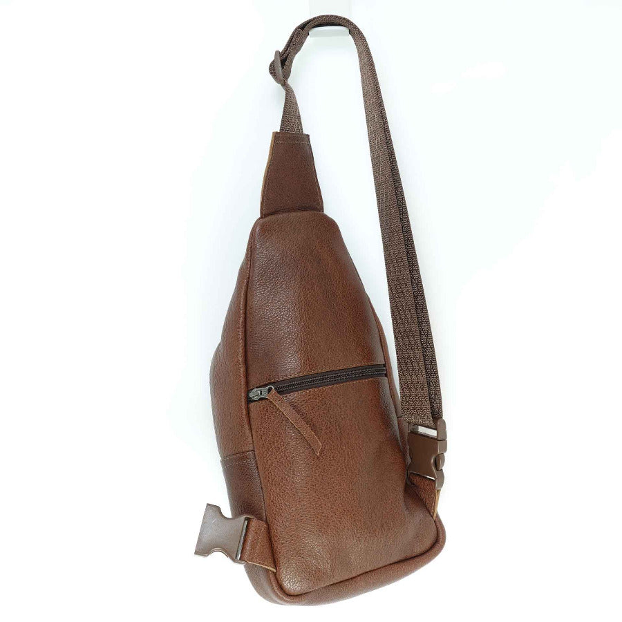 Leather sling bag in cinnamon brown, back view.  Artisan crafted in Guatemala