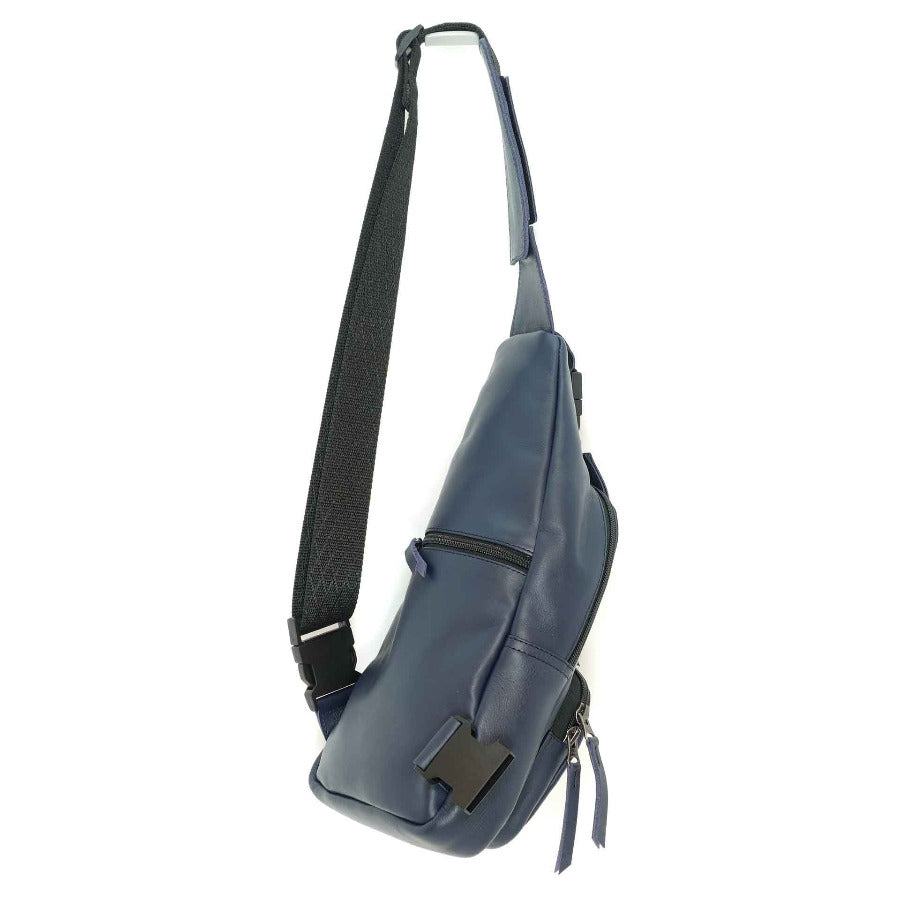 Leather sling bag in indigo blue, back view.  Hand crafted in Guatemala
